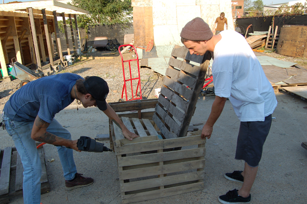 Building a throne of pallets for Hoffman to judge from...