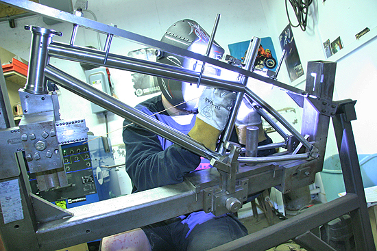 Dave tacking up Jake Kaech's custom frame.