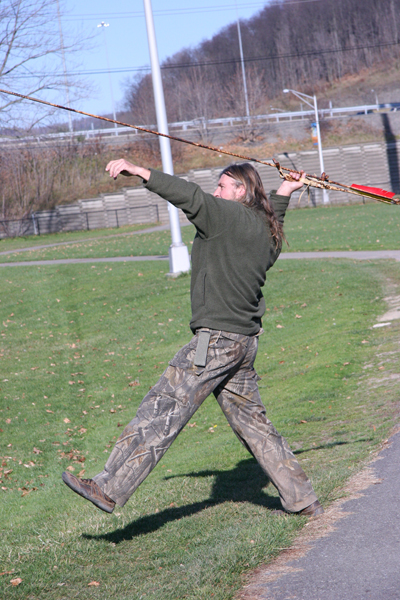 Here he takes aim at a small child playing on a swingset at a 100 yards. Near miss!