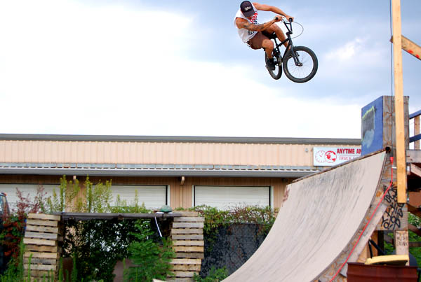 Jumping the dubbs on the half circle wooden pump track- Evan V.