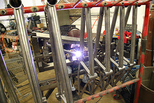 Dudes welding and frames on racks, it's what we do.