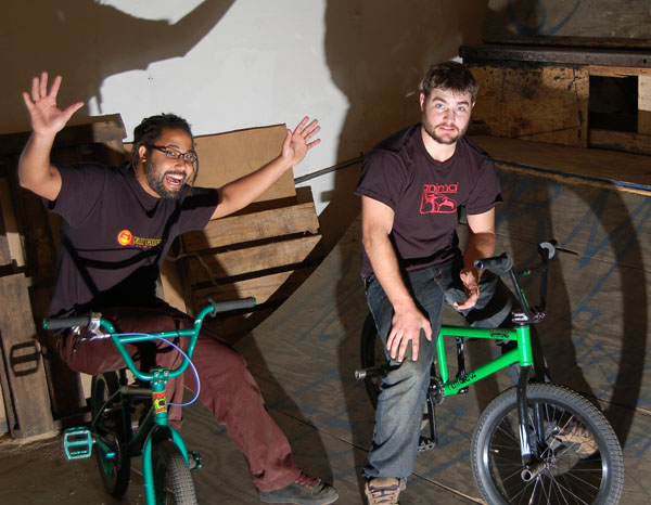 Two Friendly Johns on Green Bikes.