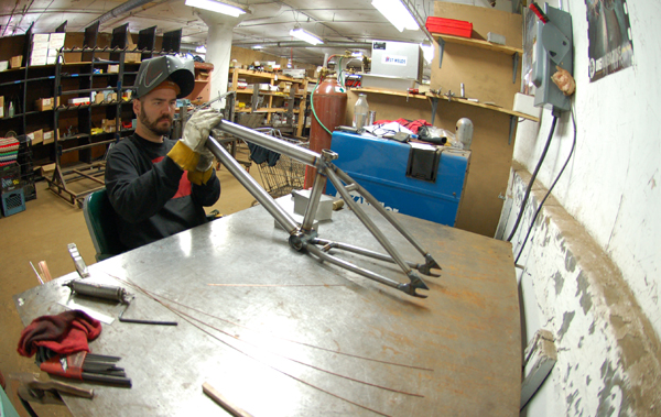 Big Dave, staring down the headtube, and inspecting his work.